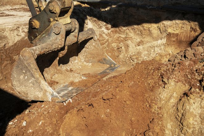 heavy-excavator-digging-day-light-outdoors.jpg